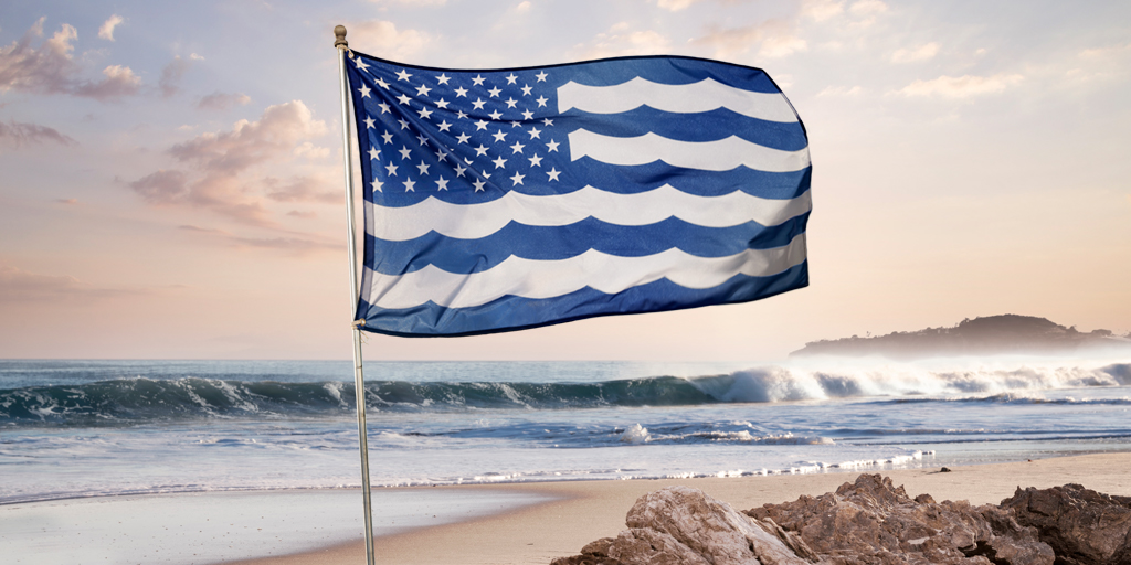 A united oceans flag on a beach