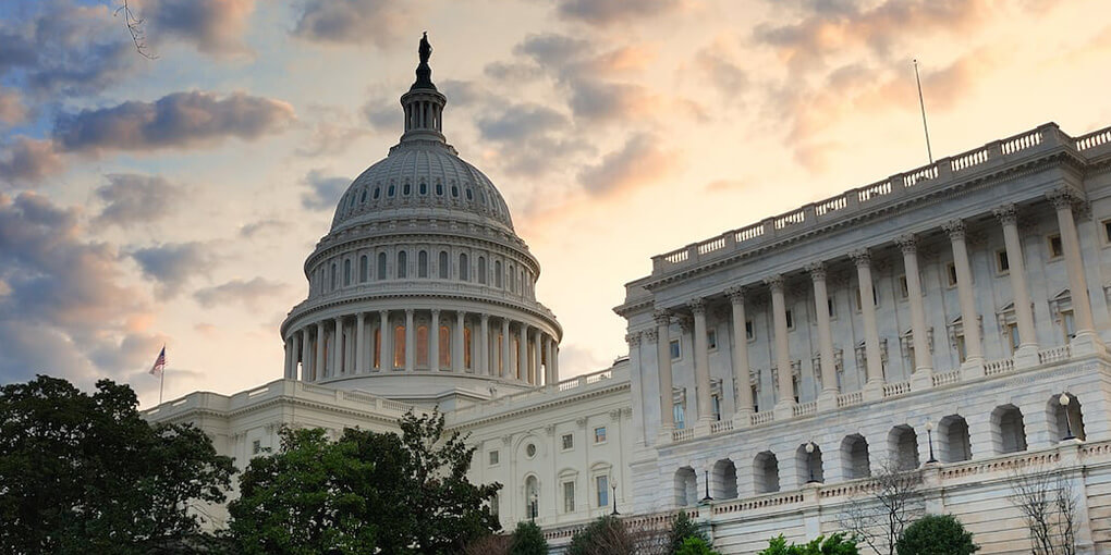 A sunset sky behind the capitol building